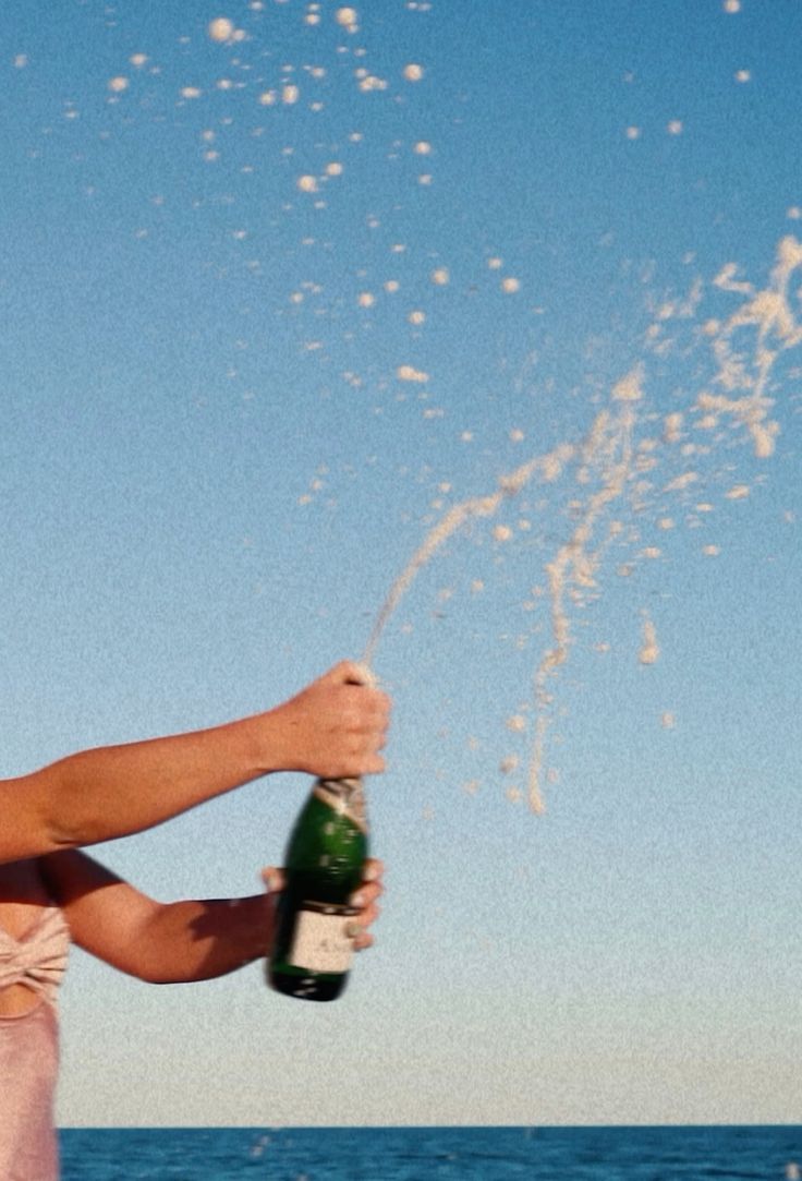 popping cork against blue sky